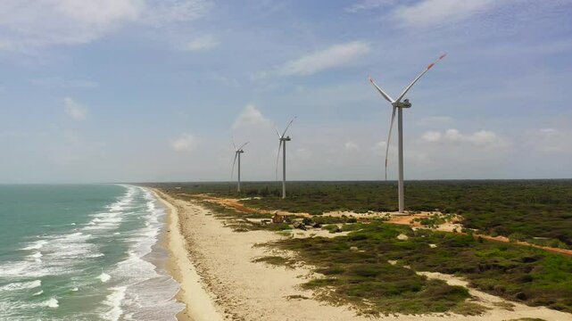 Aerial view of wind Turbine Power Generators At Sea Coastline. Alternative Renewable Energy. Mannar, Sri Lanka.