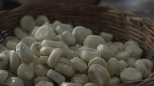 Peeled chestnuts are placed in a basket and are ready to be processed into food.