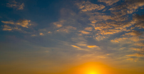 Sky at sunset. Sunrise over horizon. Sunset through clouds on sky. Twilight sky with sunset colors. Peaceful dawn with soft light. Dramatic dusk sunset with clouds. Sunshine in clear sky.