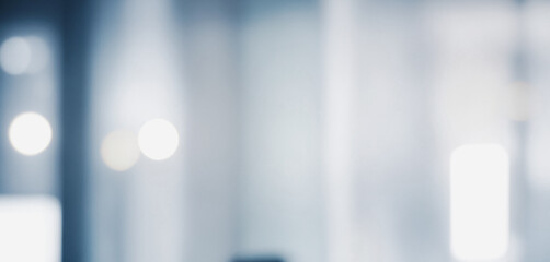 Image shows a blurred background with soft, light blue and white tones, creating a calm and minimalist aesthetic.