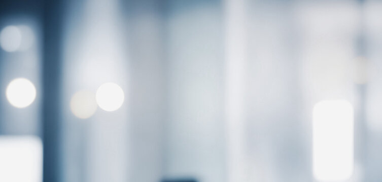 Image shows a blurred background with soft, light blue and white tones, creating a calm and minimalist aesthetic.