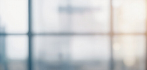 Blurry image depicting an out of focus view through an office window, suggesting a modern and professional setting.
