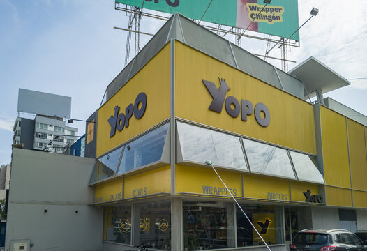 Yopo wrappers and burgers resturaut in Miraflores, Lima, Peru yellow building