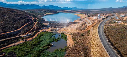 Panoramic aerial view of construction at the Clanwilliam Dam in the Western Cape, South Africa, to raise the wall. The reservoir supplies irrigation water to grape and vegetable farmers. © NAXstock