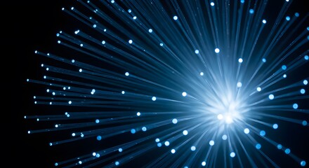 Fototapeta premium A macro shot focusing on a cluster of fiber optic cables, creating a radiant display of light points on a black background, symbolizing technology and data transmission.