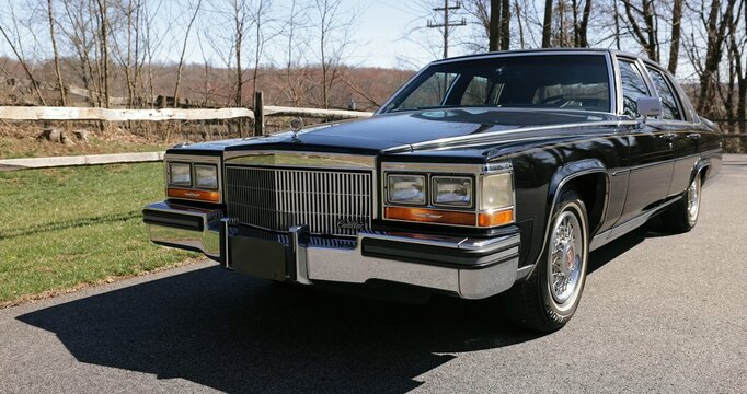 Cadillac Brougham old car on the road