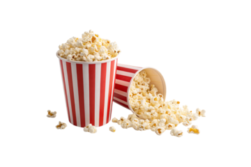 Two red-striped popcorn tubs, one spilled on side, popcorn scattered on surface, isolated on a transparent background