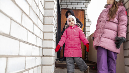 Family goes for a walk in winter in warm parks