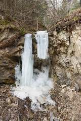  frozen waterfall in mountainous area close up