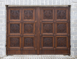 wooden gates with wood carvings