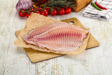 Raw Tilapia fish fillet slice