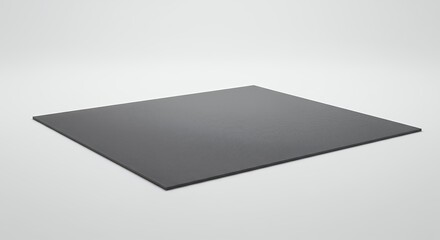 Elegant charcoal colored square surface against a gradient neutral background