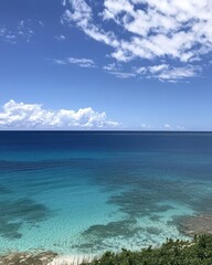 Fototapeta premium Serene Ocean View with Clear Turquoise Water and Blue Sky
