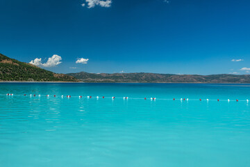 Salda Lake, Burdur, Turkey. View of Salda Lake under the blue sky with white sand and clear water. Turquoise lansdscape