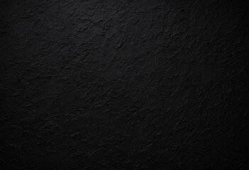 photo The background of a rough, dark textured surface fills the frame. The texture is black, with subtle variations in color that suggest a rough, cracked surface. Black day