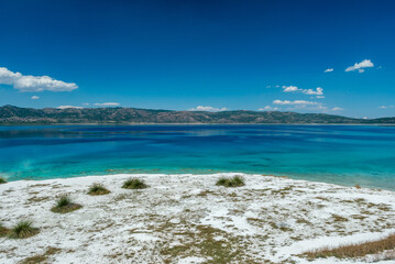 Salda Lake, Burdur, Turkey. View of Salda Lake under the blue sky with white sand and clear water. Turquoise lansdscape