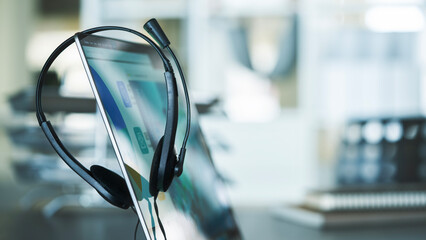 Close up headset of call center on office table, operation job concept