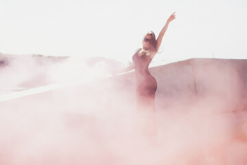 A Stylish Woman Exuding Elegance with a Pink Smoke Bomb in Her Fashionable Attire Ensemble