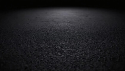 Photo of a rough wall with a thick, dark texture filling the frame. Black day, the texture is black, with subtle color variations that indicate a rough, cracked surface.