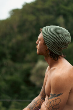 Wet man after jumping into a waterfall