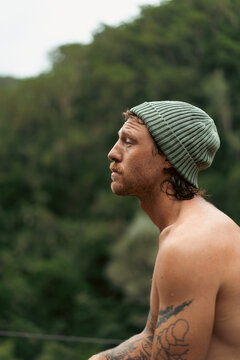 Wet man after jumping into a waterfall