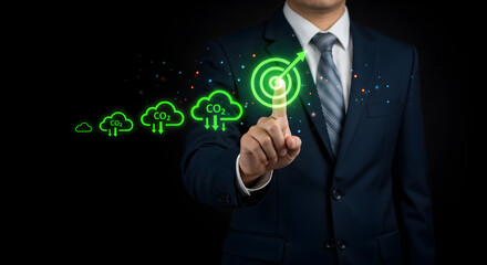 Business Man Touching Green Target Symbol Displaying Cloud Computing and Data Transfer on Black Background
