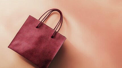 A maroon shopping bag with handles, photographed against a tan background, suggests retail or a purchase. The image appears as a thumbnail as part of a series of file uploads.

