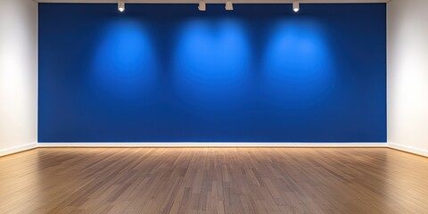 A minimalist art gallery featuring a vibrant blue wall, illuminated highlights, and a polished wooden floor, creating a serene atmosphere.