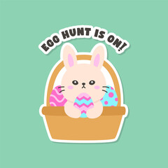 Front View of Bunny with Colorful Eggs in Basket and Egg Hunt is On! Message