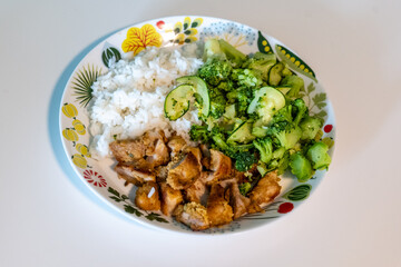 rice, chiken and broccoli on a plate. healthy food and diet concept