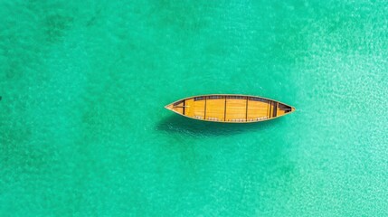 Aerial View of a Wooden Boat on Clear Turquoise Waters Surrounded by Vibrant Coral Reefs