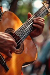 Obraz premium Hands playing a Spanish guitar outdoors
