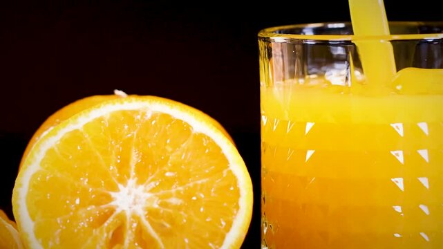 Close-Up of Orange Juice and Sliced Orange