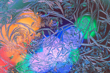 Photo of natural colorful ice texture with light on the frozen glass. Abstract background
