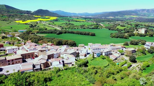 Aerial view of a picturesque spanish village nestled in green valley