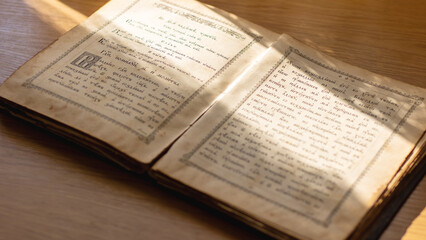 Obraz premium Belarus, Minsk - 09.03.2025: A book is currently open, revealing a page that displays the letter a on it