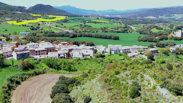 Aerial view of a picturesque spanish village nestled in lush green valley
