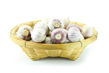 garlic in a basket, Group of solo garlic or single clove garlic in brown bamboo basket isolated on white background close up stack