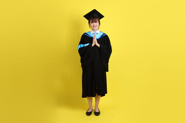 20s woman in Graduation gown