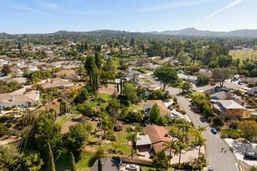 Obraz premium Spacious modern home with open layout, upgraded kitchen, light-filled bedrooms, scenic aerial views,