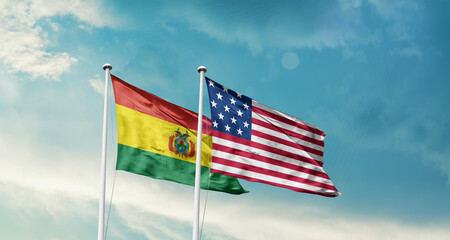 Bolivia and America friendship flags are waving in the sky.Two country flag for agreement or deal. Bolivia USA national flag for comittment.