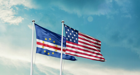 Cabo Verde and America friendship flags are waving in the sky.Two country flag for agreement or deal. Cabo Verde USA national flag for comittment.