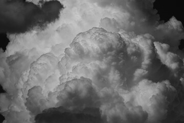 White cumulus clouds on clear blue sky background close up, beautiful aerial cloudscape view, azure skies backdrop, copy space.