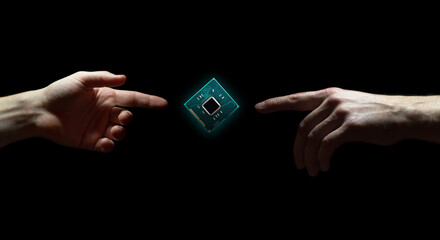 Computer chip hovers above hand on black background