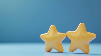 two yellow stars are sitting on a table