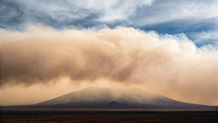 Majestic Mountain Overcast by Dust Storm and Clouds in Dramatic Landscape View