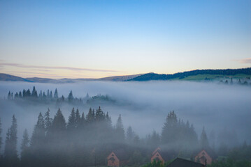 Mountains in the early morning fog