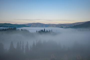 Mountains in the early morning fog