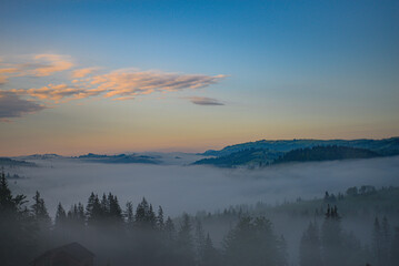 Mountains in the early morning fog