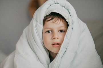 Cute Child under blanket